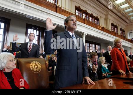 Austin Texas USA, January 11, 2011: Republican lawmaker Larry Taylor of Friendswood takes the oath of office in the Texas House as the 82nd Legislative session gets underway in Austin. Republicans have a 101 to 49 majority over Democrats in the Texas House this year. ©Bob Daemmrich Stock Photo