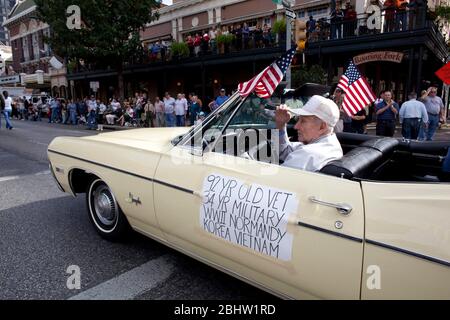 Austin Texas USA, November 11, 2010: 92-year-old veteran Ed Deittrick of Austin drives his vintage convertible car in the annual Veterans Day parade up Congress Avenue toward the State Capitol in downtown. ©Bob Daemmrich Stock Photo
