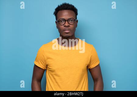 Smart young african american man in glasses looking confident at camera Stock Photo