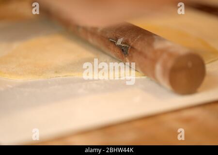 Rolling out fresh pasta in Rome Italy Stock Photo