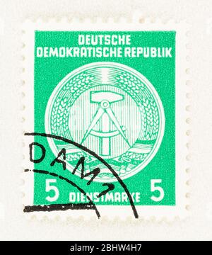 SEATTLE WASHINGTON - April 26, 2020: Green Official Stamp of Administration of DDR featuring hammer and compass. Stock Photo