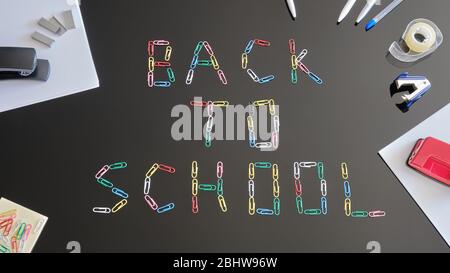 Back to School concept - flat lay composition. Paperclips forming the words on black reflexive table, surrounded by sheets of paper and school related Stock Photo