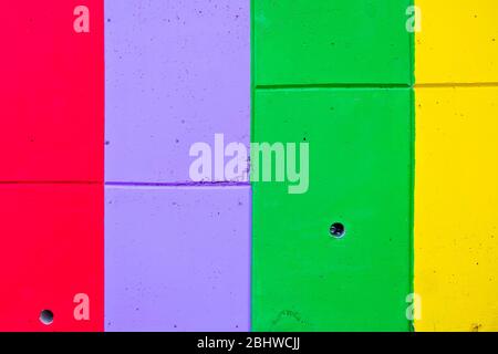 Colorful stripes painted on the wall, vertical and horizontal, in bold saturated colors. Stock Photo