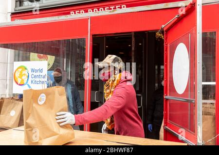 New York, United States. 27th Apr, 2020. Renowed chef Marcus Samuelsson of Red Rooster restaurant helps distribute free food to needy people during COVID-19 pandemic in Harlem (Photo by Lev Radin/Pacific Press) Credit: Pacific Press Agency/Alamy Live News Stock Photo