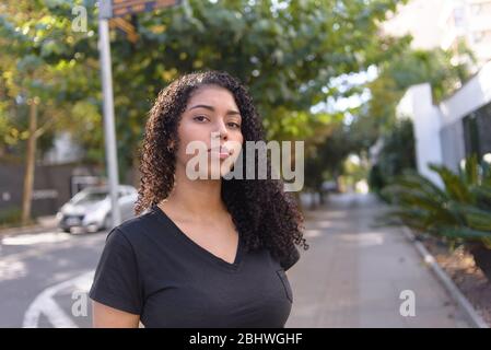 Black woman on urban background in casual clothing Stock Photo