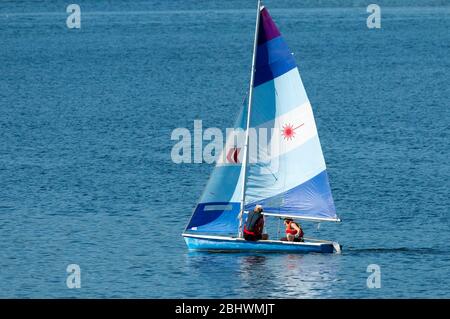 Twp people on a sailboat off the coast of Vancouver Island, B. C., Canada Stock Photo
