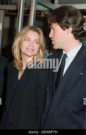 LOS ANGELES, CA. c.1994: Actress Michelle Pfeiffer & husband David E Kelly.  File photo © Paul Smith/Featureflash Stock Photo