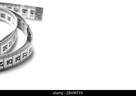 The figure is helix of a centimeter tape. Isolate measuring tape on a white background. Stock Photo