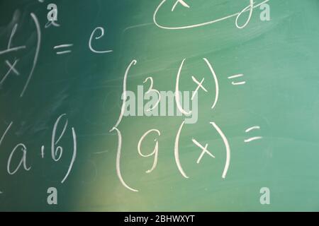 Mathematics formulas on blackboard background Stock Photo