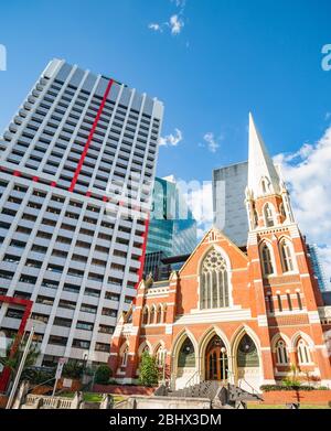 Brisbane Australia - March 17 2013; Albert Street Uniting Church traditional architecture  and contrasting modern office building street view. Stock Photo