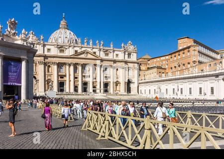 Vatican City, Rome, Italy - September 18th 2017: Tourist visiting the Apostolic Palace, St Peters Square. Many tourists visit the city each year. Stock Photo
