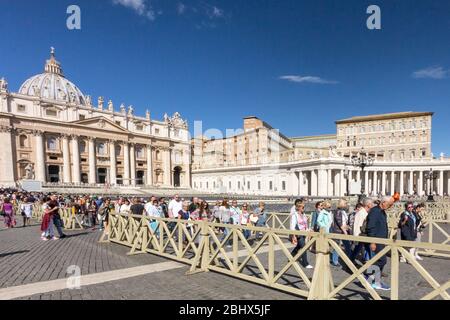 Vatican City, Rome, Italy - September 18th 2017: Tourist visiting the Apostolic Palace, St Peters Square. Many tourists visit the city each year. Stock Photo