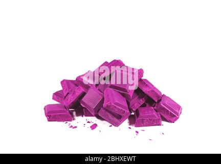 Pop Art Style Vivid Purple Colored Pile of Chocolate Chunks Isolated on White Background Stock Photo