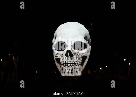 Skull on black background projected outside Stock Photo