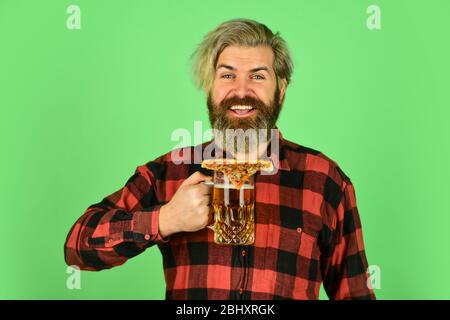 nice pub menu. man watching football while drinking beer and eating pizza. eating pizza and drinking. take-away pizza. Best party here. bachelor men club. Having fun and drink in bar. Stock Photo