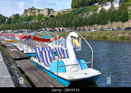 Pedal boats with swan on the Semois river and the castle of Godefroid (Godefroy) de Bouillon in the tourist center of Bouillon in Belgium Stock Photo