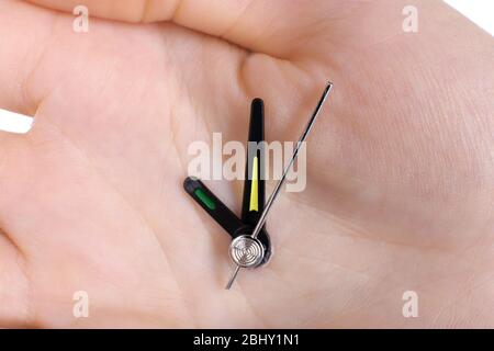 Hand holding clock arrows close up Stock Photo