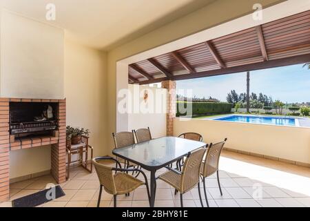 Balcony terrace of a modern apartment overlooking its own pool, barbecue for the holidays of family and tourists. Stock Photo
