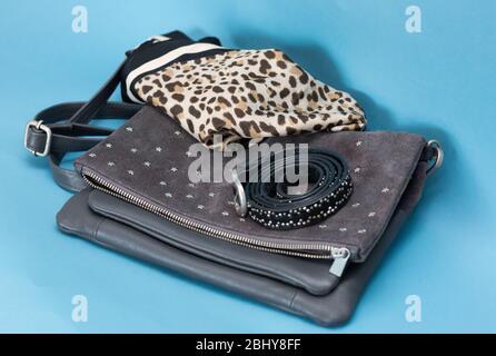 Suede star studded bag with scarf and belt Stock Photo