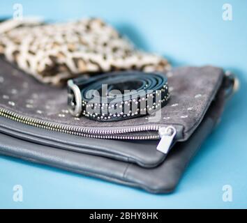 Suede star studded bag with scarf and belt Stock Photo