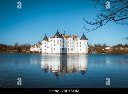 Flensburg Germany 9/4/20 Castle of Glücksburg an ancient Building in the middle of a lake Stock Photo