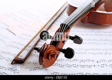 Classical violin on music sheets background Stock Photo