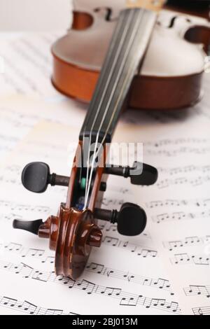 Classical violin on music sheets background Stock Photo