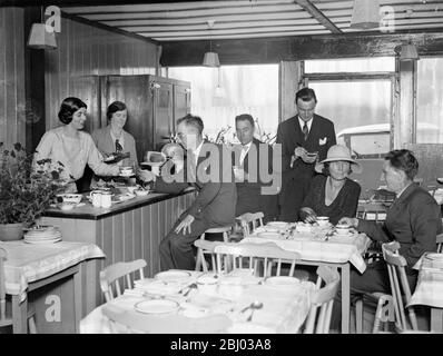 Sir CHarles Burdett and Baroness Poppy Rednig Von Trebnitz run restaurant in the city . - Sir Charles Burdett , with Baroness Poppy Hedwig von Trebnitz , and Miss Grace Corwell , for four years a V A D who was decrated during the war , have opened a restaurant together in Bridge Lane , Fleet Street . - 29 June 1932 Stock Photo