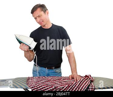 Adult man independently irons his shirt, isolated on white Stock Photo