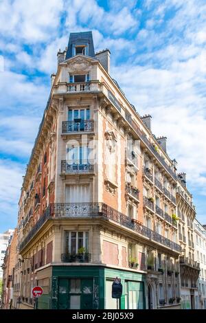 Paris, France, famous pink house and buildings in Montmartre, in a typical street Stock Photo