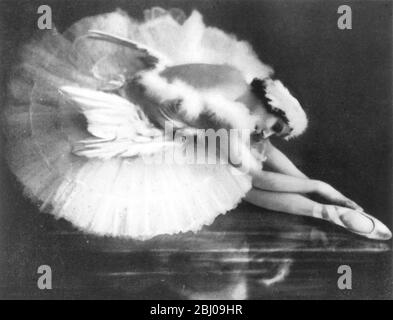 ANNA PAVLOVA 1931 - as The Dying Swan from SWAN LAKE - - The meringue-based dessert, Pavlova, is named after the Russian ballerina Anna Pavlova. The dessert is believed to have been created in honour of the dancer either during or after one of her tours to Australia and New Zealand in the 1920s. Stock Photo