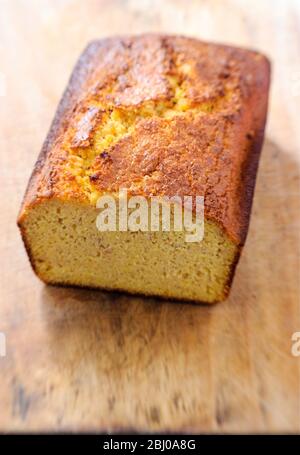 Home made gluten free cornbread loaf on wooden board Stock Photo