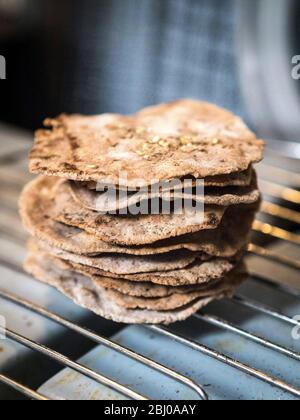Homemade buckwheat crispbreads, drying on old Rayburn Stock Photo