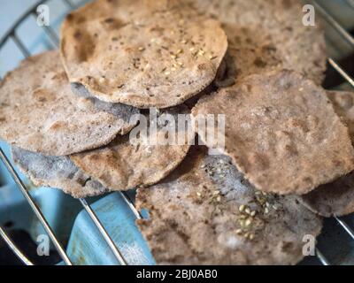 Homemade buckwheat crispbreads, drying on old Rayburn Stock Photo