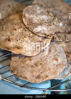 Homemade buckwheat crispbreads, drying on old Rayburn Stock Photo