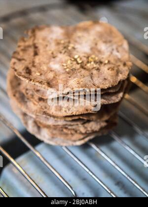 Homemade buckwheat crispbreads, drying on old Rayburn Stock Photo