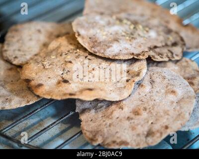 Homemade buckwheat crispbreads, drying on old Rayburn Stock Photo