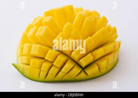 Fresh mango showing technique for cutting into cubes - Stock Photo