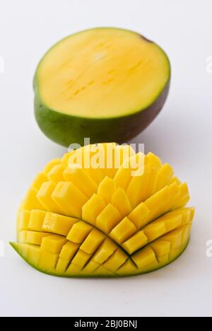 Fresh mango showing technique for cutting into cubes - Stock Photo