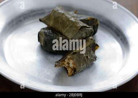 Pork and rice stuffed greek dolmades in vine leaves - Stock Photo