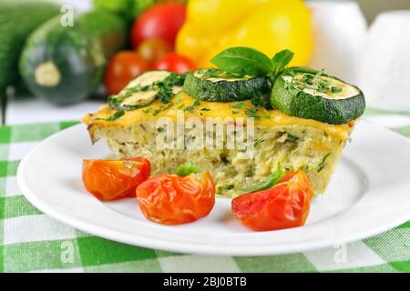 Casserole with vegetable mallow in white plate on table, closeup Stock Photo