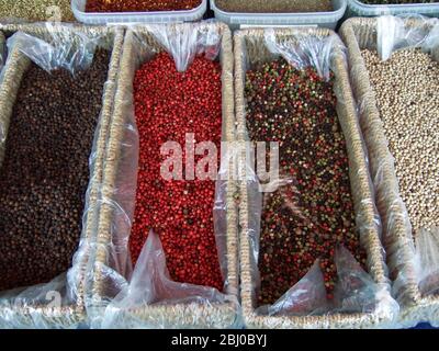 Various sorts of peppercorns on market stall in Edenbridge Kent - Stock Photo