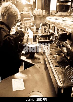 Interior details of Costa coffee shop at motorway service station, showing espresso machine. - Stock Photo