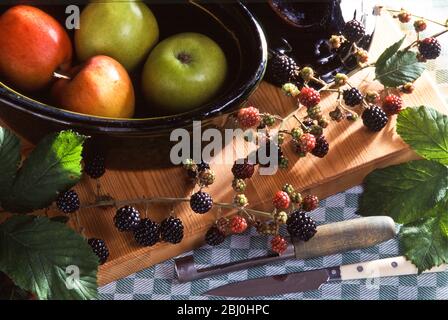 Ingredients for blackberry and apple pie in kitchen setting - Stock Photo
