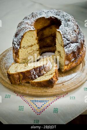 Cinnamon yeast cake baked in tall ring shaped cake tin Stock Photo