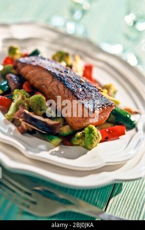 Grilled salmon fillet on mixed vegetables - Stock Photo