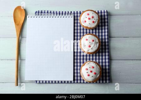 Open recipe book on wooden background Stock Photo