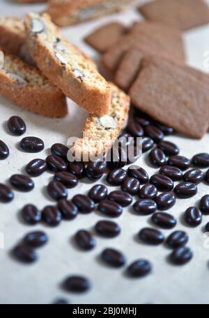 Cantuccini and spekuloos biscuits with chocolated coated coffee beans - Stock Photo
