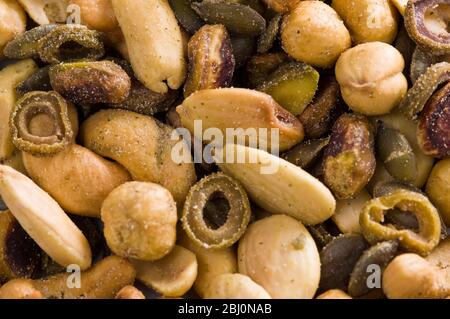 Mixed salted nuts and seeds - Stock Photo