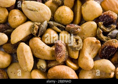 Mixed salted nuts and seeds - Stock Photo